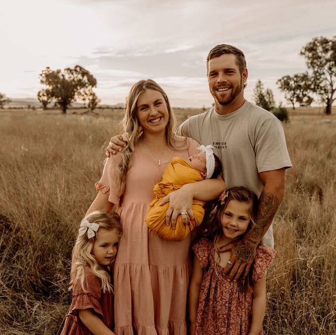 PORTRAIT OF LOVE: Mitchell Doring, his partner Breanna Todd and their children, Ella, Thea and Mila. Photo: Emilie Ruttley
