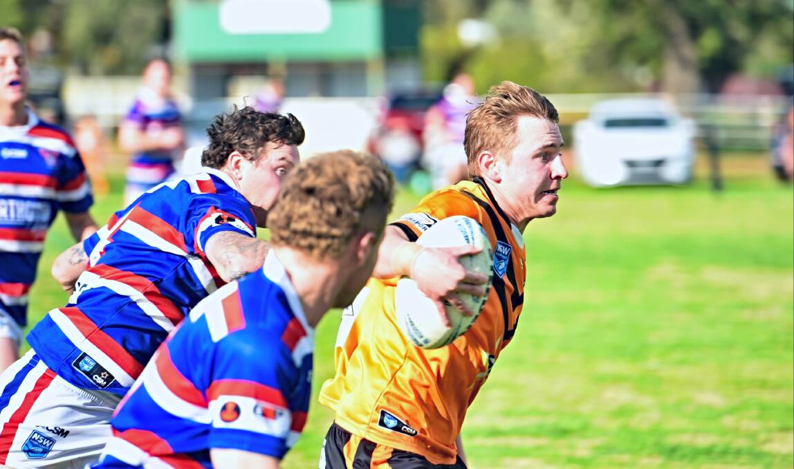 Tigers No 1 Dylan Walker pins the ears back en route to the tryline against Gunnedah at the Manilla Showgrounds on Saturday. Picture by Mark Bode