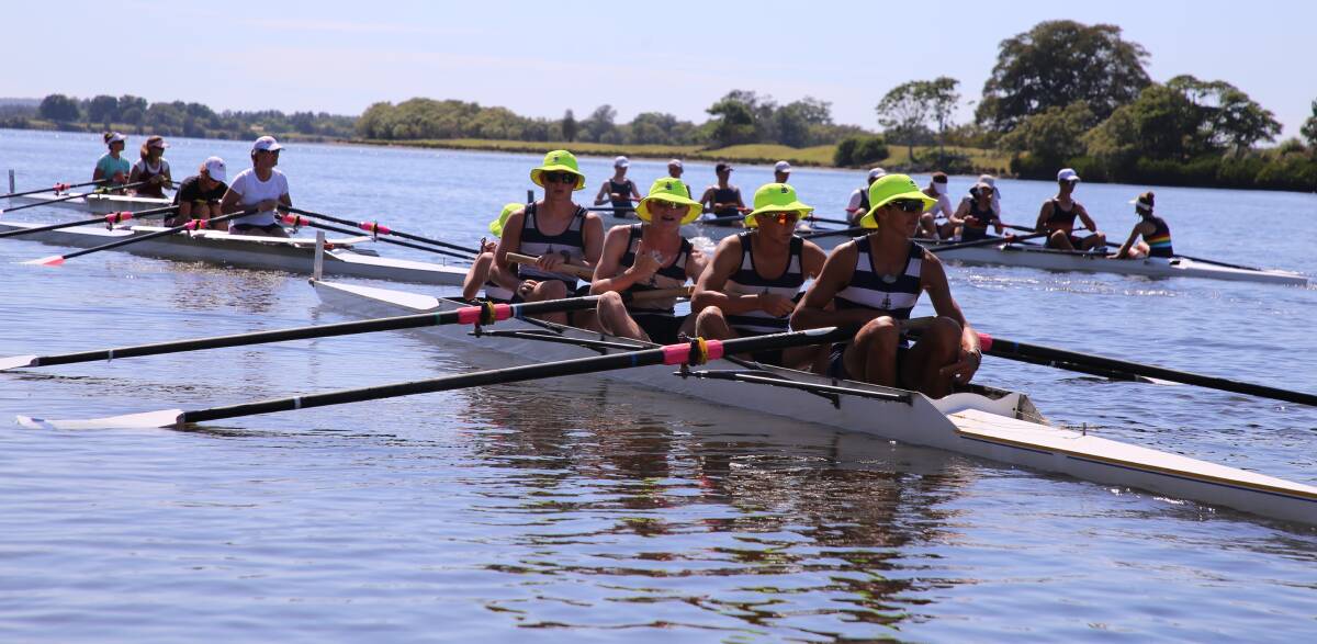 POWER OF FOUR: Jack Sewell, John Moore, James O’Brien and Remy Taylor (with coxswain Bronte Garcia obscured) row up the Manning River, to the starting line.