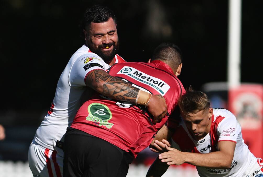 Andrew Fifita, left, corrals a Bear. Picture by Gareth Gardner 