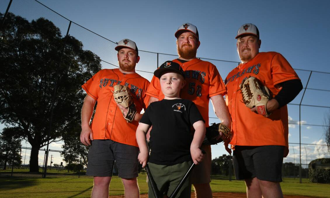 BLOOD TIES: Brothers Keegan, Kris and Jeremy Bird will play for Outlaw against Cougars in Saturday's grand final. Also pictured is Kris's son Noah.