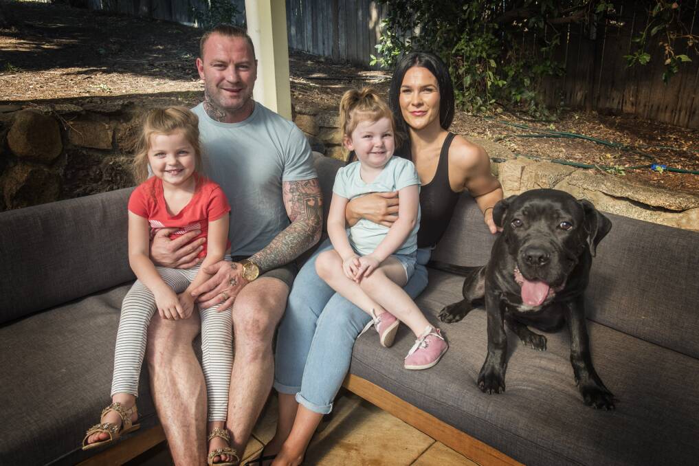 BEAR CLAN: Norths forward Josh Schmiedel, his wife, Rachel, and their kids, Evie, 4, and Maxie-Rae, 3. and Kane the dog. Photo: Peter Hardin 120419PHC015
