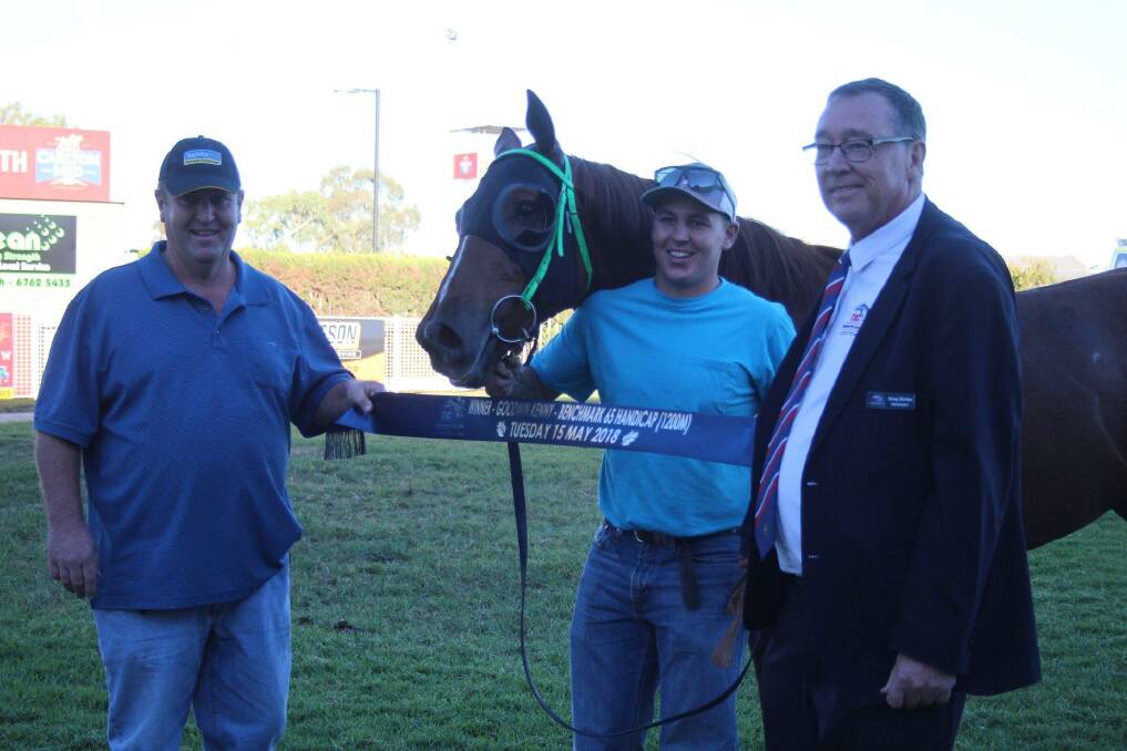 WINNING GRINS: Mark and Zach Hatch with Iwatani and Tamworth Jockey Club president Greg Birtles after Tuesday's win. Photo: Rachel Young TJ
