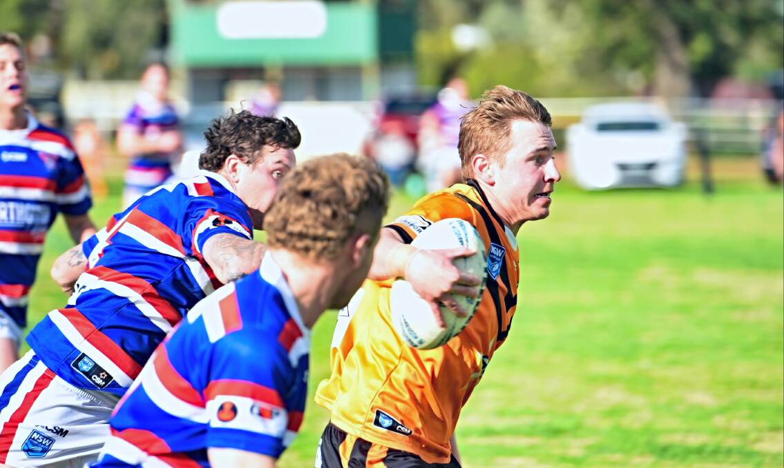 Tigers No 1 Dylan Walker pins the ears back en route to the tryline at Manilla. Picture by Mark Bode