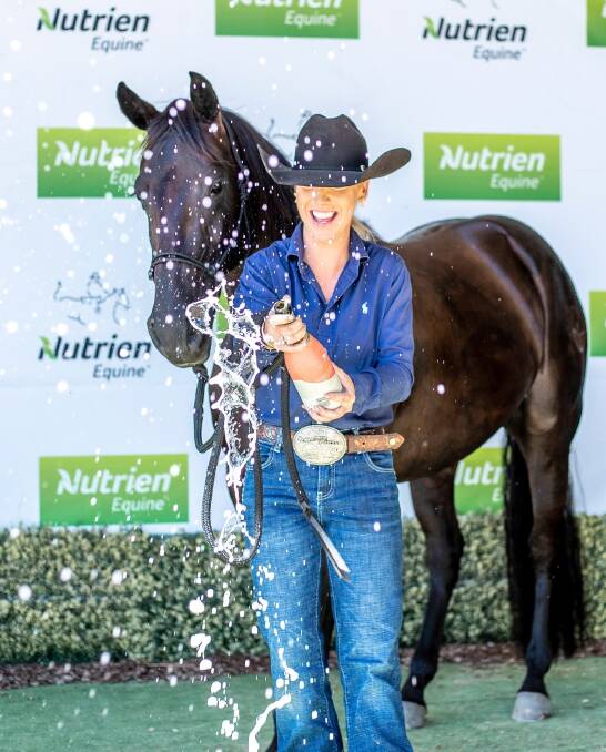 CORK-POPPER: Holly Clayden celebrates Bad In Black's record-breaking price tag at the Nutrien Equine Classic Campdraft and Sale. Photo: Penwood Creations