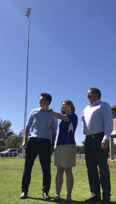 LIGHT IDEA: MP Kevin Anderson, Savannah Shepherd, of the Tamworth Kangaroos, and Mayor Col Murray inspect the new lighting. Photo: Supplied