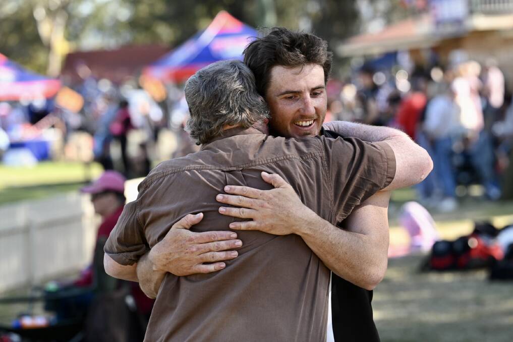 Hayden and Ian Chappel embrace after the grand final. Picture by Gareth Gardner 