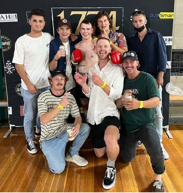 THE BOYS: Josh McCulloch celebrates with childhood friends after winning his pro debut. Photo: Facebook