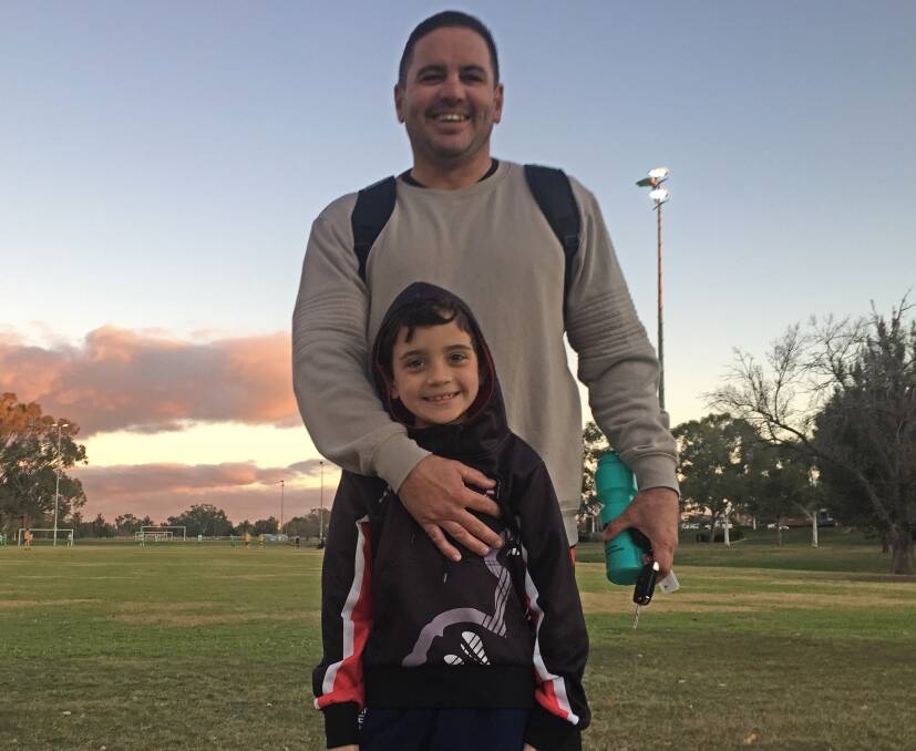 CODE-HOPPER: New Moore Creek striker Andrew Moodie and his son Regan, 7, after Saturday's win over Kootingal. 