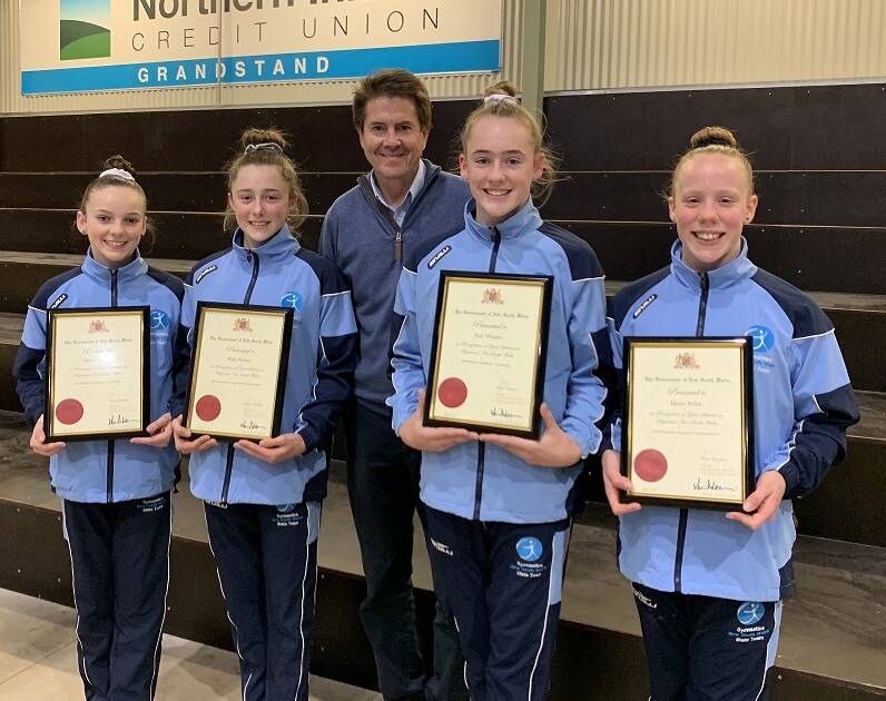 YOUNG GUNS: Tamworth MP Kevin Anderson with gymnasts Amber Downes, Paige Seaton, Josie Douglas and Maisie Wilde. Photo: Supplied