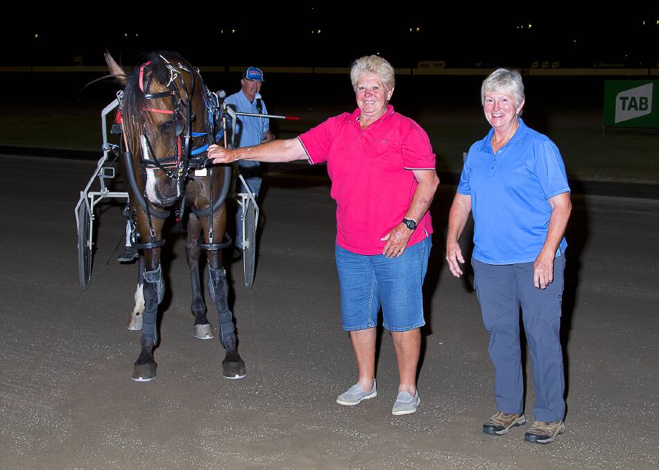 A-TEAM: Leslie Jeffriess and Sue Grills with their winning pacer Brie. Photo: PeterMac Photography