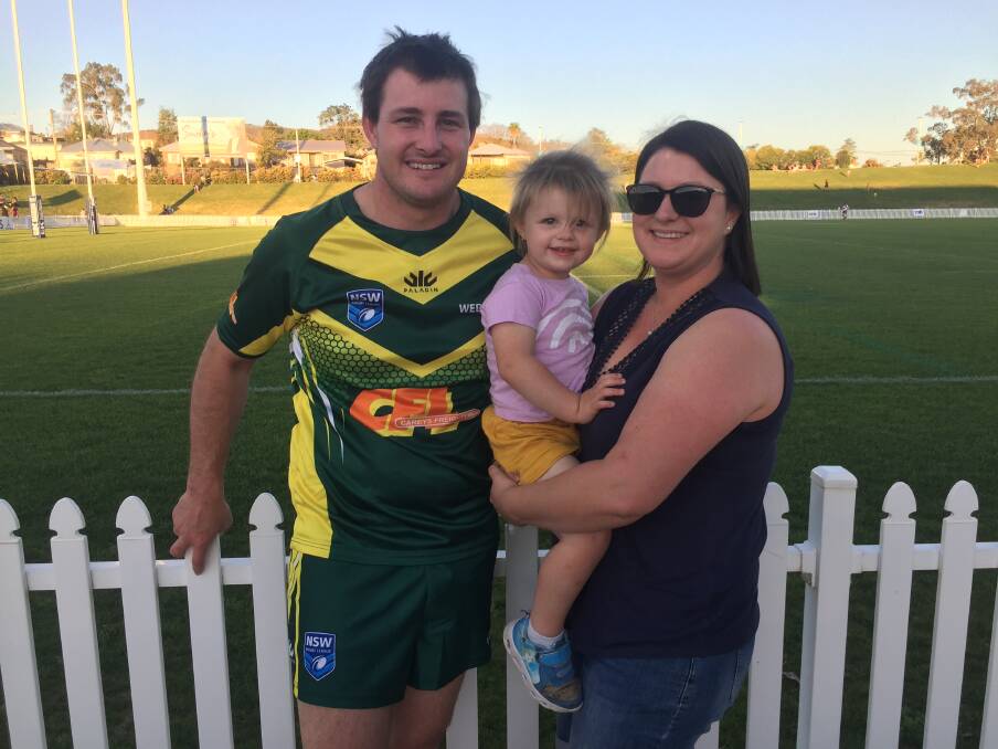 SPECIAL TIME: Travis "Jock" Small with his wife, Leesa, and their daughter, Olivia, at Scully Park on Saturday. Photo: Mark Bode