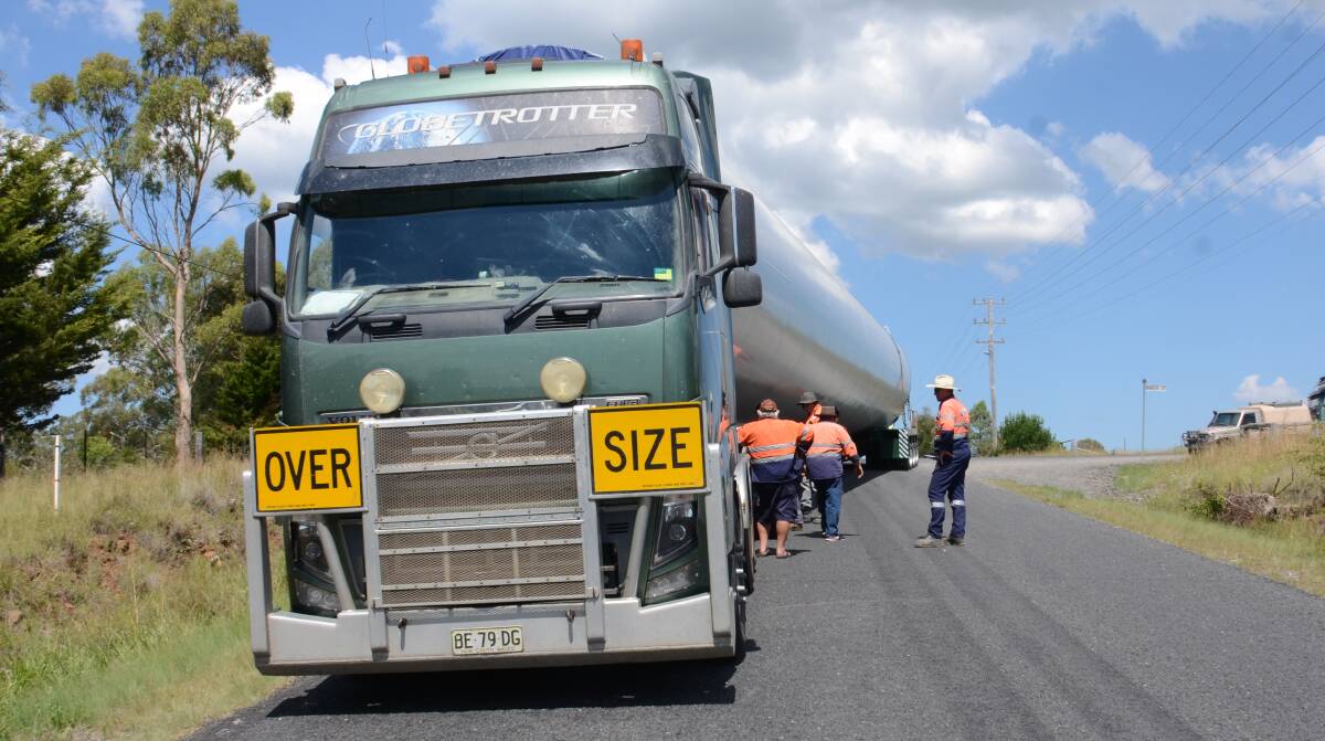 Wide load blocks road: A truck loaded-up and heading for the White Rock Wind Farm comes to a standstill in Glen Innes on Monday afternoon.