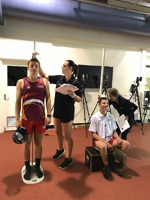 Preparation: Morgan Dunn and Will Mozzell from the Inverell RSM AFL program undergo the UNE testing process.