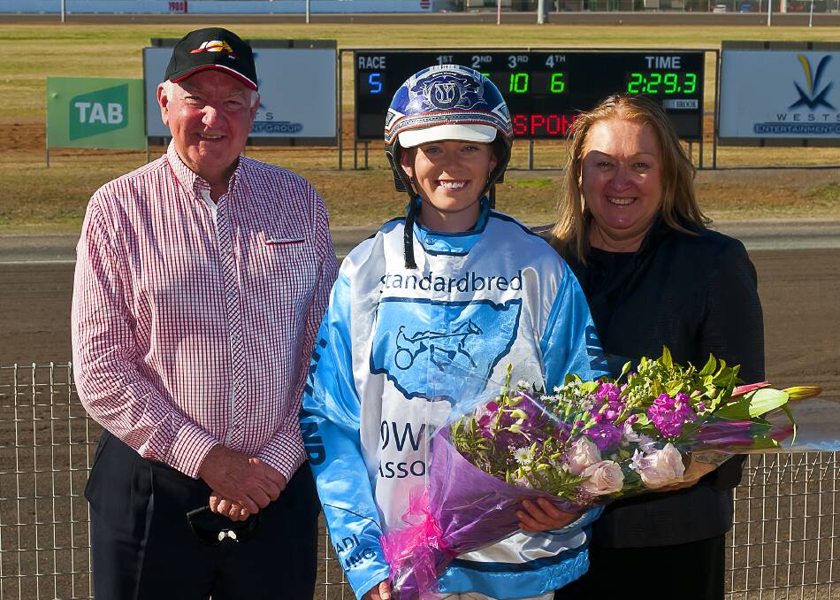 All smiles: Michael Brown NSWSOA, Madi Young and Tamworth chairperson Julie Maughan after a recent visit of Madi Young back to the Tamworth Paceway.