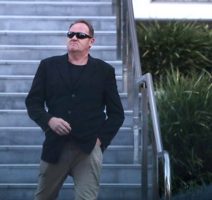 Shane Kember leaves Wollongong courthouse during a previous court appearance. He was jailed for at least 17 months on Friday over his role in the illegal supply of a black market pistol at his home in 2016.