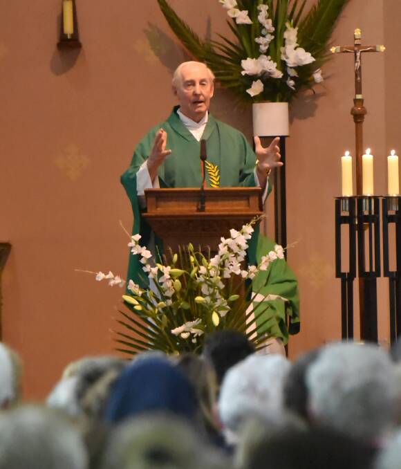 DIAMOND SERVICE: Father Tom Shanahan celebrates an incredible 60 years of serving as a priest with a packed congregation at St Nicholas Catholic Church on Sunday. Photo: Geoff O'Neill 240716GOB03