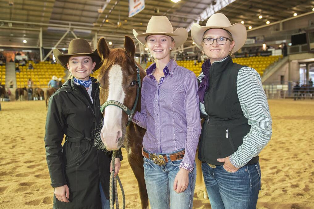 KEEPING IT IN THE FAMILY: Matilda, 19, Jasmine, 16, and Jacinta Shumack with 'Fair Lady Flash' at the National Cutting Horse Association Futurity Finals at AELEC on Sunday. Photo: Peter Hardin