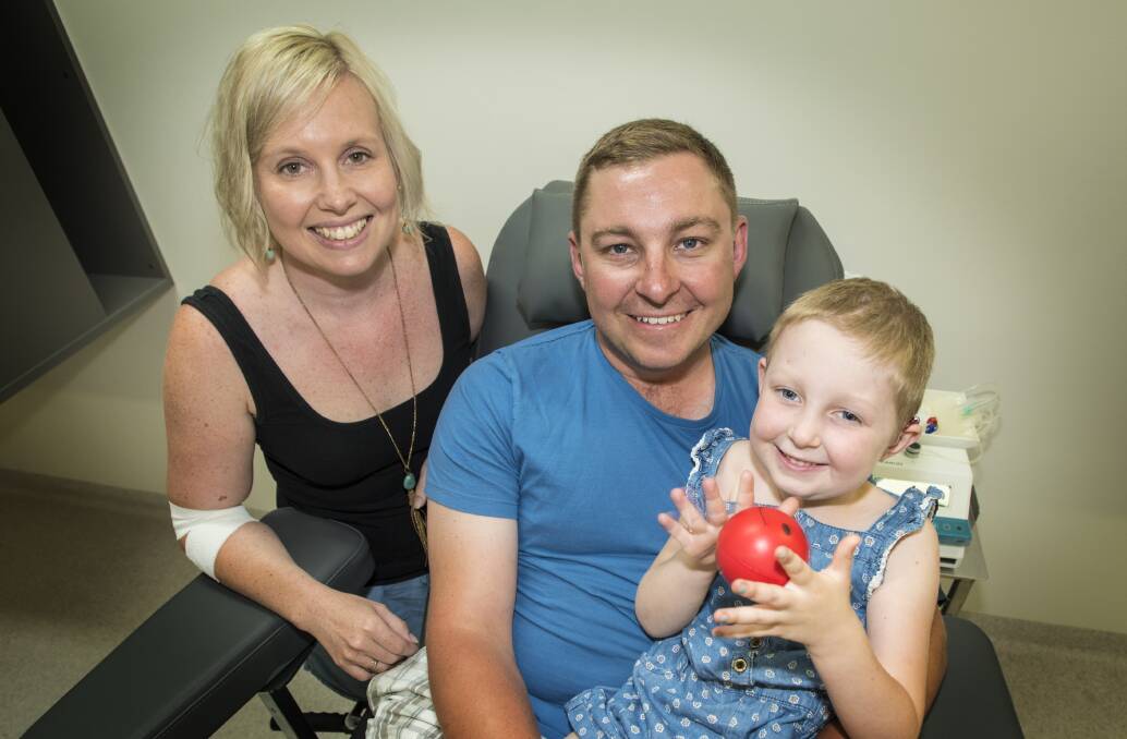 HELPING HANDS: A fundraising bowls day will be held at Tamworth City Bowling Club on Saturday for Katie and Matt Brown and daughter Chloe, 5, who contracted mastoiditis last year. Photo: Peter Hardin 201216PHD009