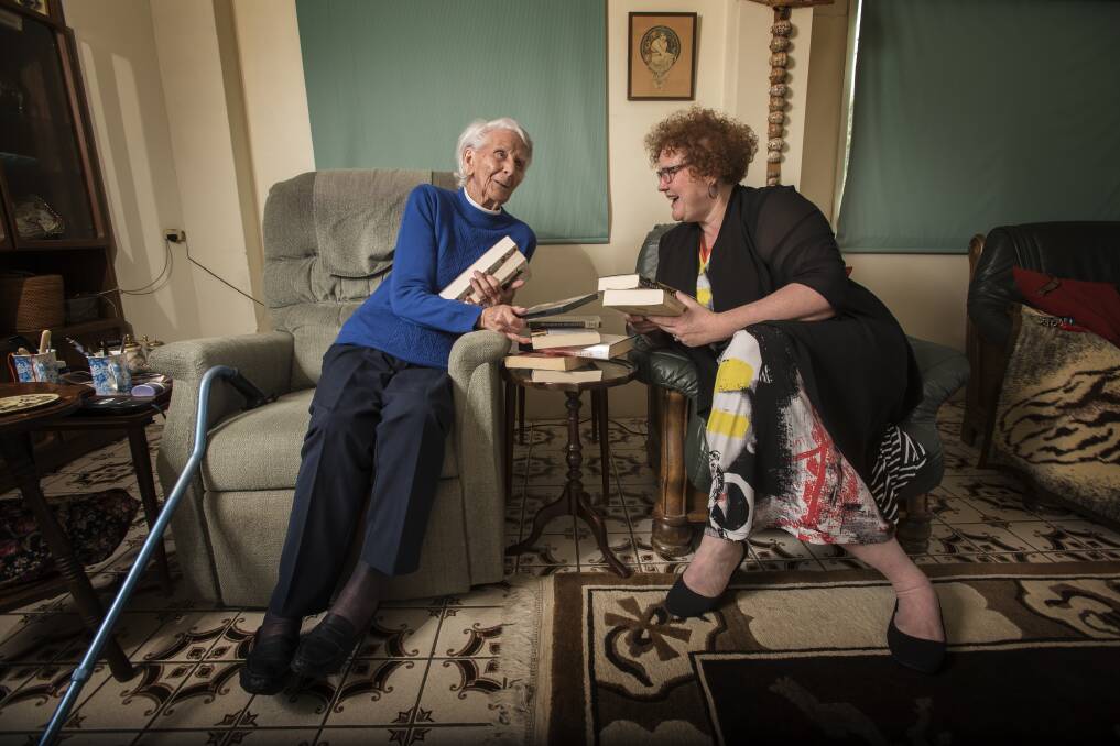 NOVEL IDEA: Bette Forrest, 95, has been using the Home Library Service for six years. She chats all things books with Tamworth Regional Library's outreach officer Lisa Cunningham. Photo: Peter Hardin