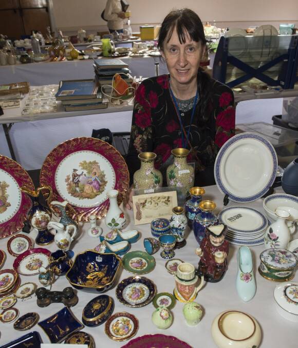 TURN BACK THE CLOCK: Robyn Clarke shows off  some treasured wares at the ninth annual Manilla VRA Antiques Fair, which featured famed antiques dealer Gordon Brown offering appraisals. Photo: Peter Hardin 011016PHC027