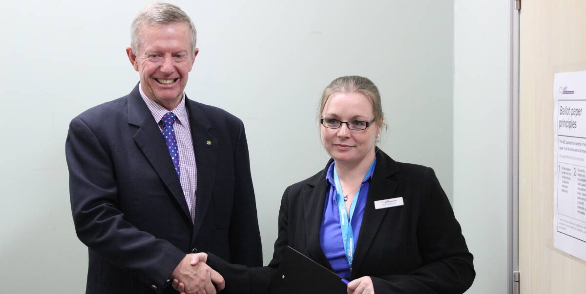 INCUMBENT: Mark Coulton is officially declared federal member for Parkes by Erin Eames, Divisional Returning Officer at Dubbo office of the Australian Electoral Commission. Mr Coulton has held the seat since 2007.