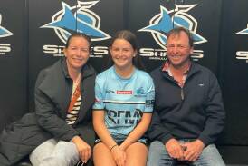 Liliana Reardon with her parents Bec and James. Picture supplied.