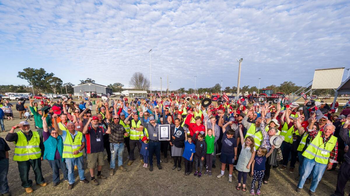 The crowd celebrates breaking the world record in the tractor parade at Inverell. Picture supplied.