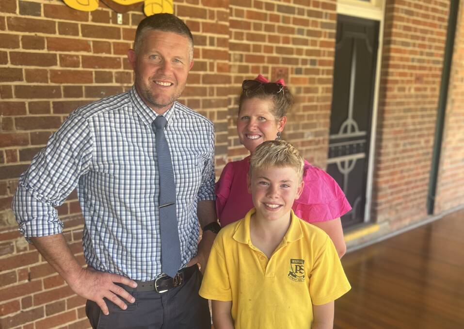 Warialda high jumper Hugo Barwick (front) with Warialda Public School principal Dan van Velthuizen and sports co-ordinator Naomi Cole who are helping to prepare the young champion for the national titles on November 24. Photo supplied.