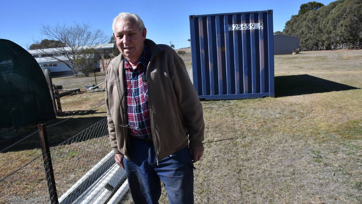 Rex Holley at the scene of the crime. The plumbing was left but three tanks were hoisted over the fence.