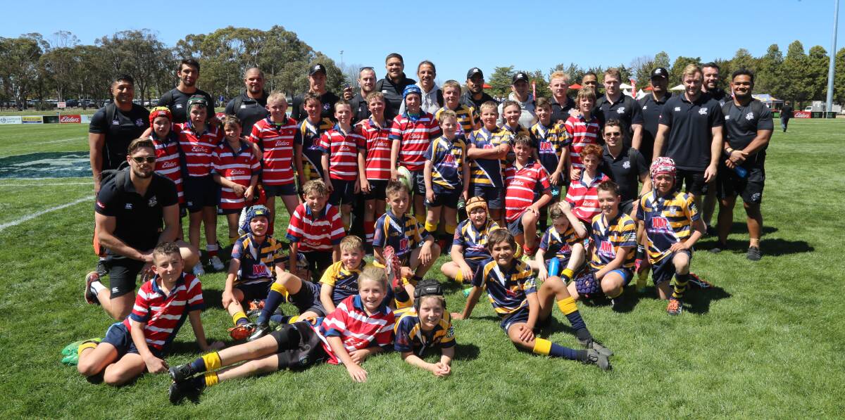 GOOD DAY OUT: Walcha junior rugby players met the Country Eagles prior to the National Rugby Championship match in Armidale on Sunday. Photo: Andrew Frazer