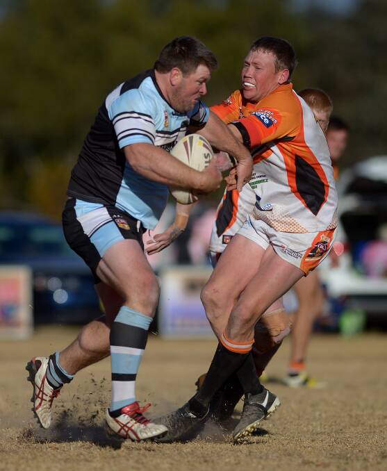 MISSED OUT: Guyra's Dan Vidler is tackled by Uralla's Duncan Elks on Saturday. Photo: Grant Robertson. 
