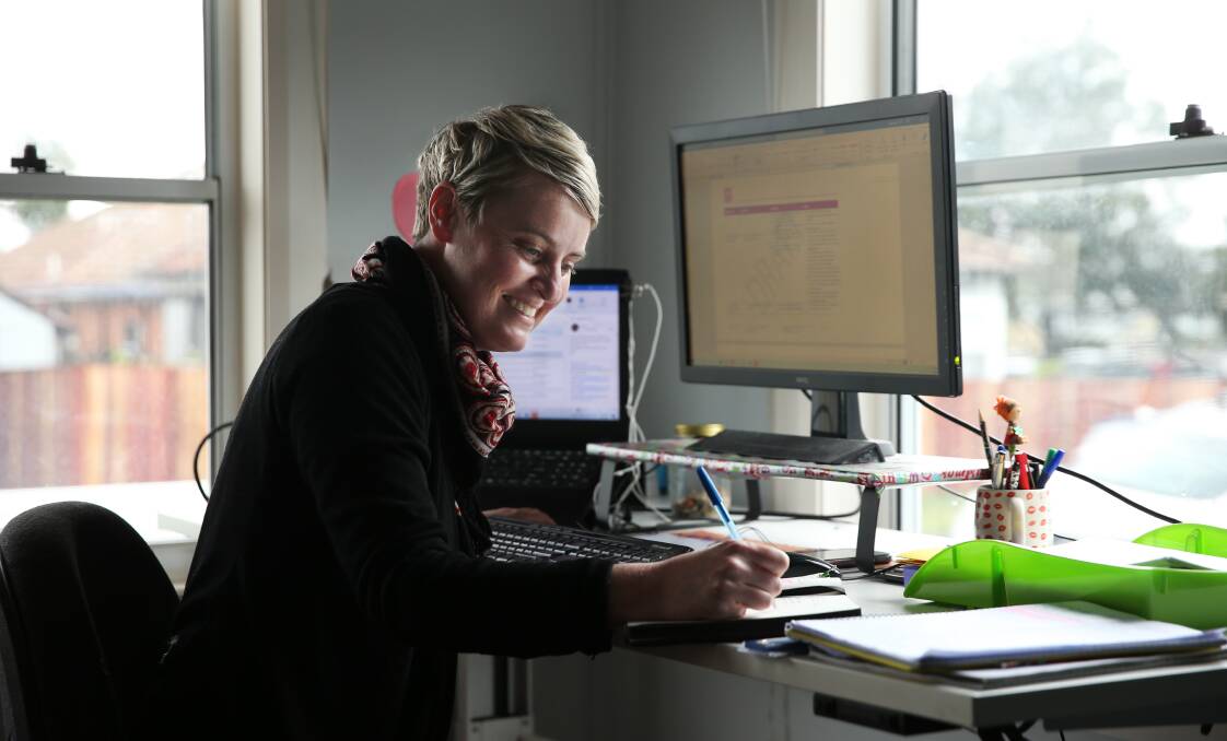 CHALLENGE: Kate Baartz working at her home office set-up. Picture: Simone De Peak 