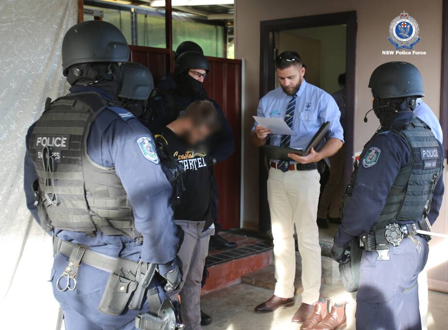 Charges: Police arrest the 27-year-old in Sydney. Photo: NSW Police