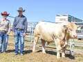 Amy Whitechurch of 4 Ways Charolais, Inverell, and Shane Murphy of Tayglen, Dysart, Qldm with top price bull 4 Ways MK R18E , who sold for $28,000. Photos: Ben Harden