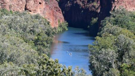 Kayakers dwarfed by the scale of Boodjamulla National Park