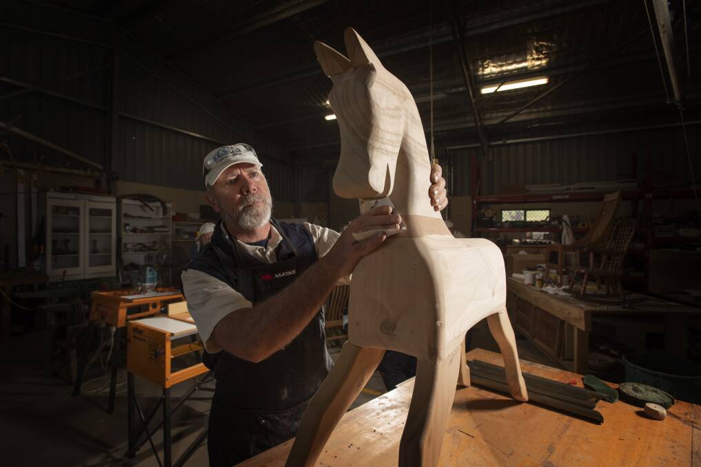PASSION PROJECT: Paul Cavanagh likes to builds and restore rocking horses at the
Tamworth Community Men's Shed. Photo: Peter Hardin 180620PHA008