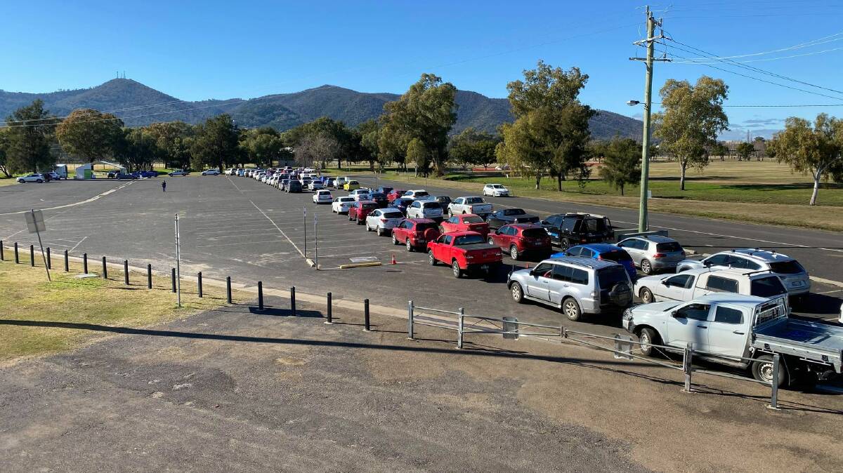 COVID QUEUES: Three long lines of cars clogged the drive-through COVID-19 testing clinic in Tamworth on Monday as the state's case count rises. Photo: Anna Falkenmire