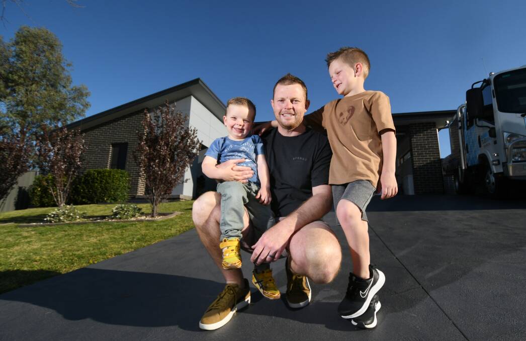 FATHER'S DAY: Darcy, 2, and Nash, 6, will without a doubt find a way to treat dad Troy Carroll despite lockdown in Tamworth. Photo: Gareth Gardner 030921GGF05
