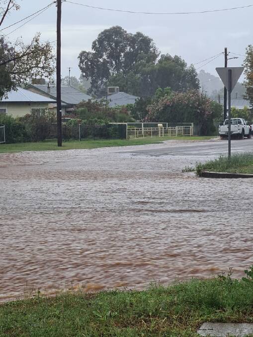 WET WEATHER: A street in Gunnedah was covered in water after heavy rain overnight. Photo: Fiona Langdon