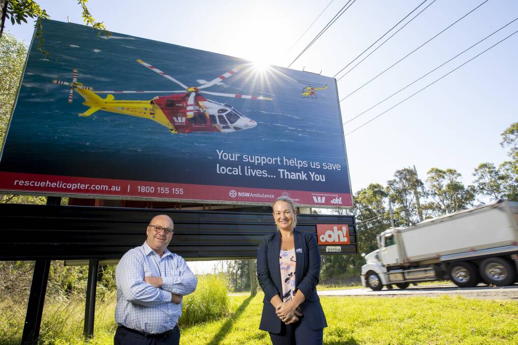 Westpac Rescue Helicopter Service CEO Richard Jones OAM and Cassandra Agnew with one of the billboards as part of the new appeal. Photo: Westpac Rescue Helicopter Service