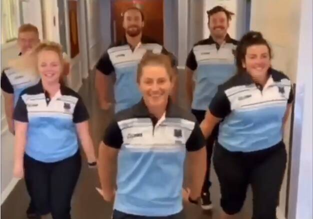 DAY FOR DANCING: Steph Halpin (centre) and the other PDHPE teachers made a fun video for their students at home. Photo: Tamworth High School Facebook