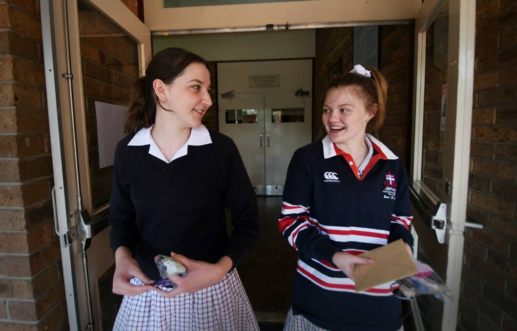 ONE DOWN: Calrossy Year 12 students Hannah Wilson and Lara Pearson leave their first written HSC exam. Photo: Gareth Gardner