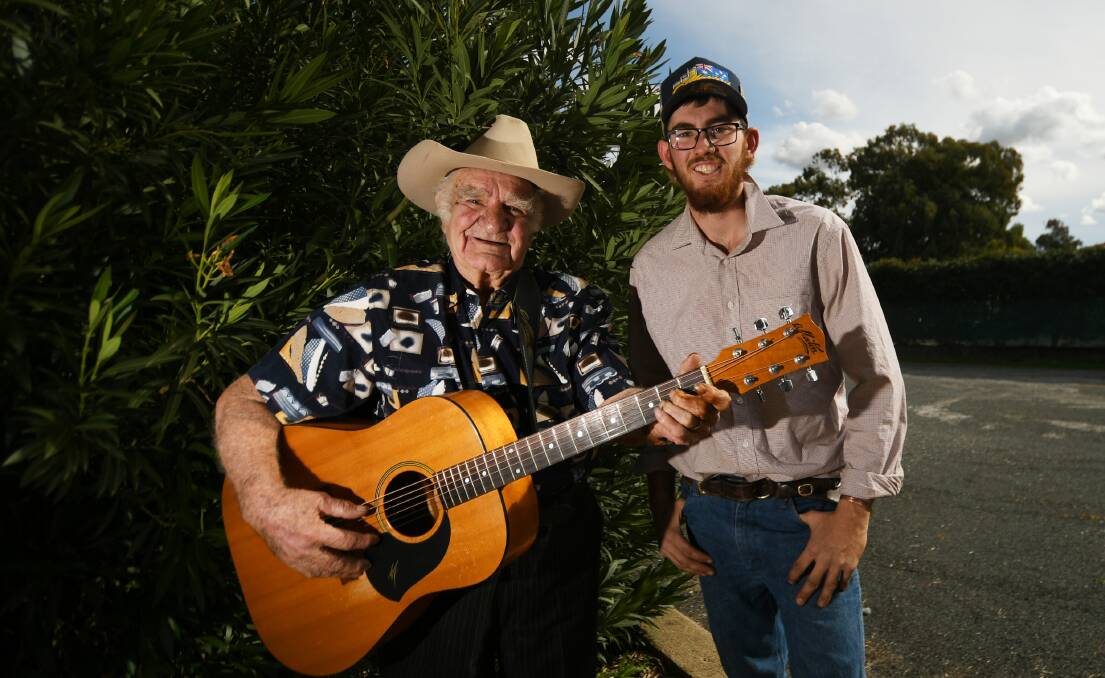 MATES: Col Taylor and Tommy Chesterfield may be decades apart, but both have one thing in common - they are passionate bush balladeers. Photo: Gareth Gardner 090720GGC01