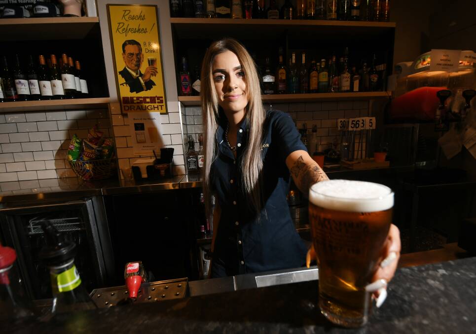 BEER AND BOOGIE: Chantel Payne is a bartender at the Tudor Hotel. Photo: Gareth Gardner