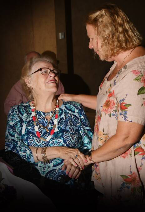 DECADES OF SERVICE: Volunteer Sue Adams congratulated Betty Burgmann on a huge 55 years of service with Meals on Wheels. Photo: Gareth Gardner