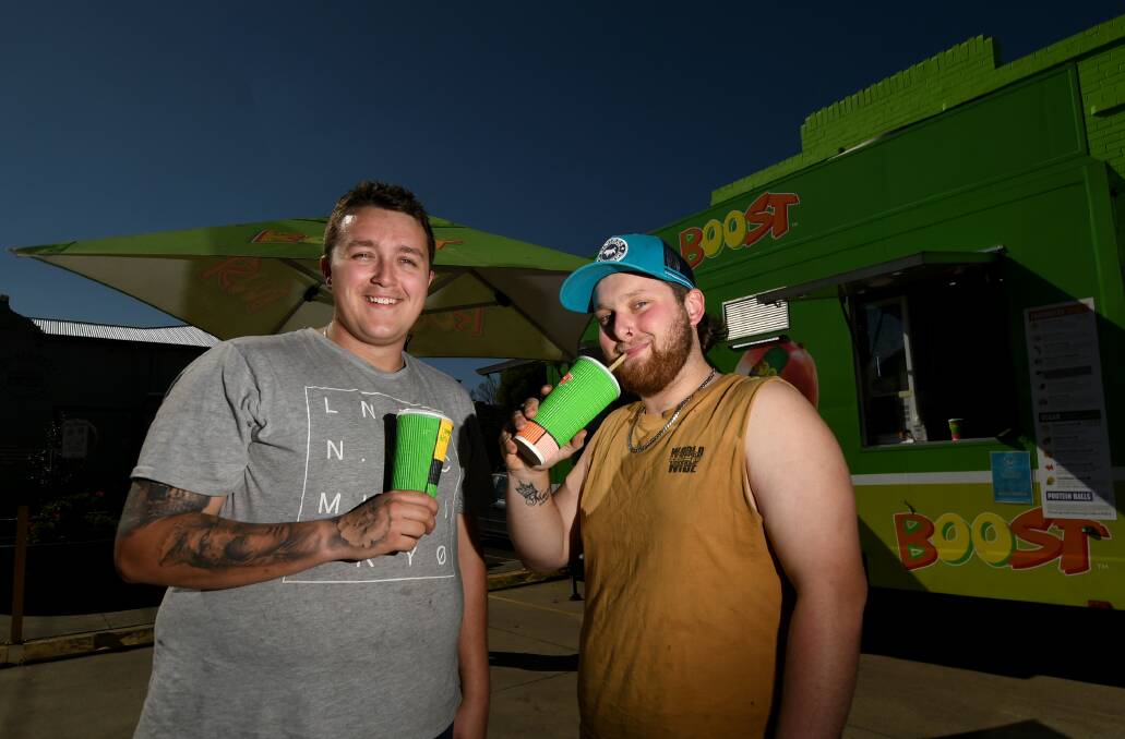 POP UP: Zee Robards and Jack Marshall enjoy a treat from Boost Juice's pop up Tamworth store. Photo: Gareth Gardner