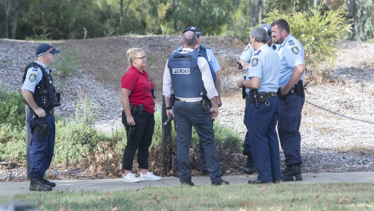SEARCH: Police swarmed the riverbank area near Scott Road on Tuesday morning. Photos: Peter Hardin