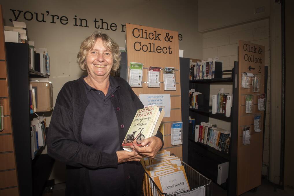 NEW PAGE: Michel Mutton at the Tamworth Library click and collect station, which allows contactless book borrowing for readers. Photo: Peter Hardin 300320PHF011
