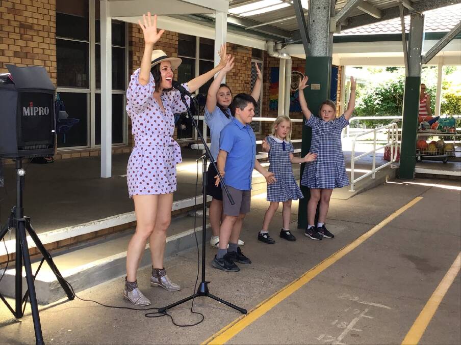 DANCE: Country music sweetheart Amber Lawrence made the trip to Nundle Public School to teach the kids some moves. Photo: Supplied